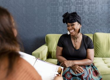 Woman selecting her new hair with the beauty consultant