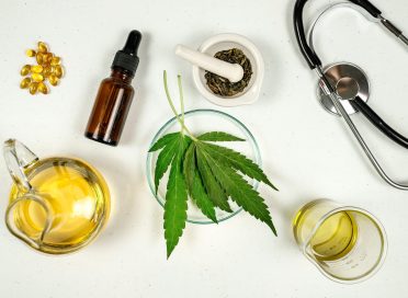 cbd thc oil medical treatment in doctor laboratory. natural medicine on clinical research . top view.