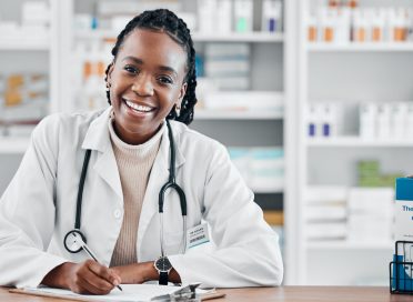 Black woman, pharmacist portrait and smile consultant with stock and health research for wellness. .